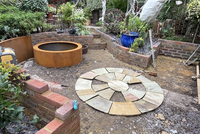 Adding paving slabs in new garden design